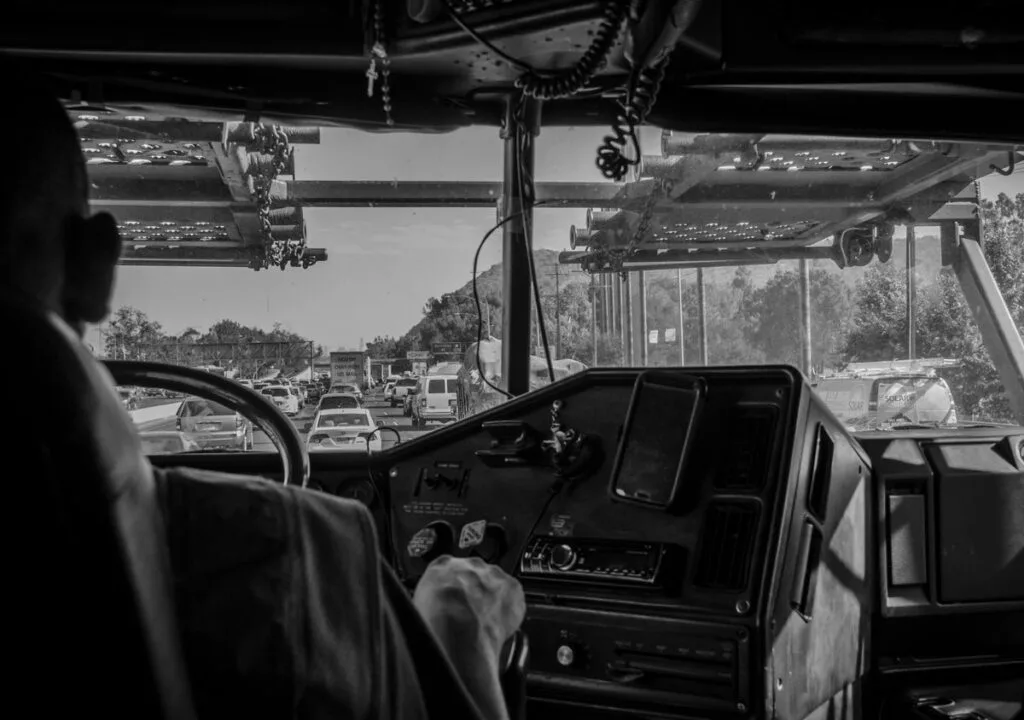 View from inside a truck cab of the dashboard and the road ahead