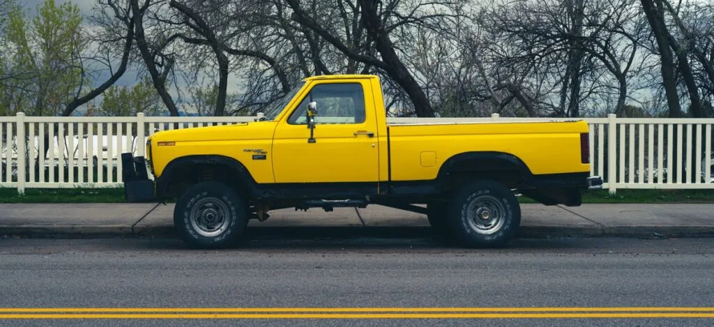 A pickup truck parked by a roadside