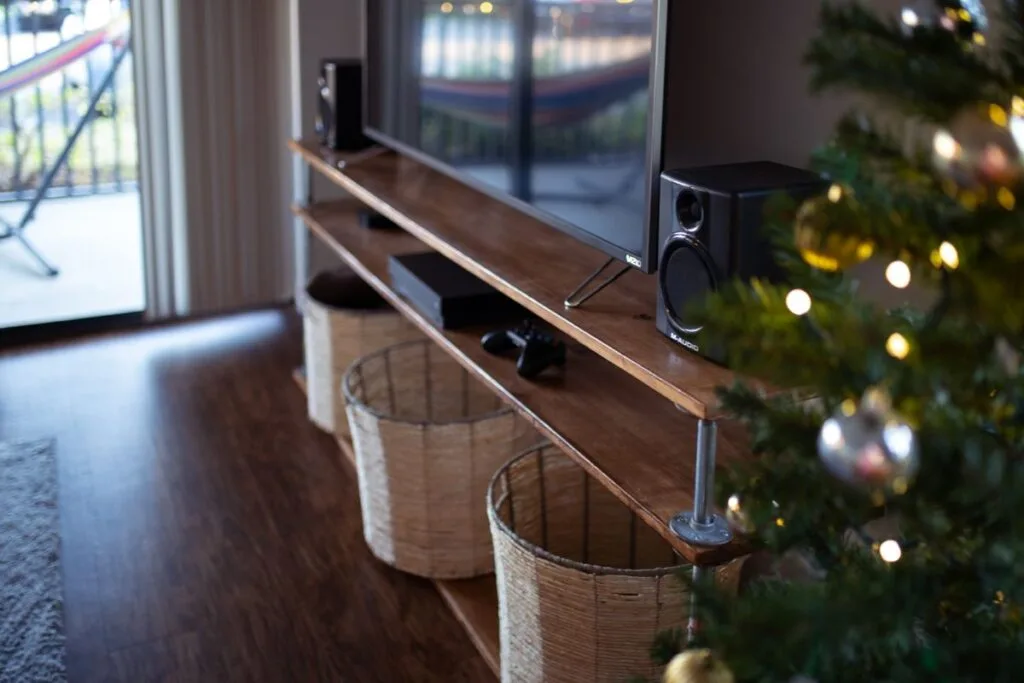 A floor-standing tower speaker in a living room