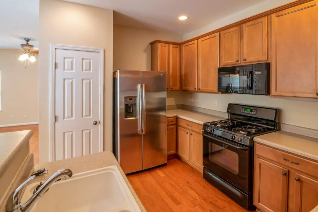 Stainless steel refrigerator and freezer in a modern kitchen