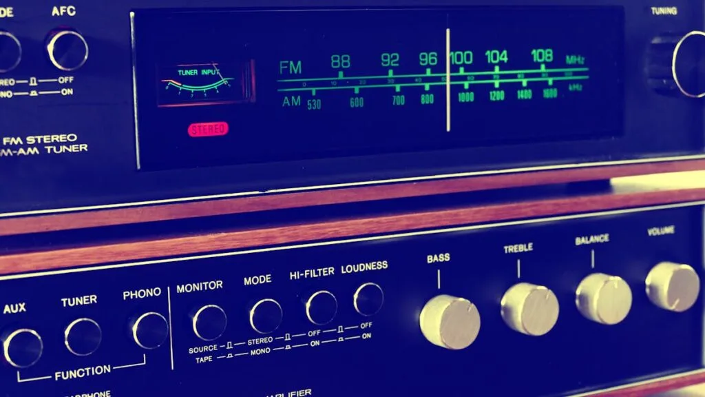 Stereo AV receiver front panel with tuning dial and tone controls